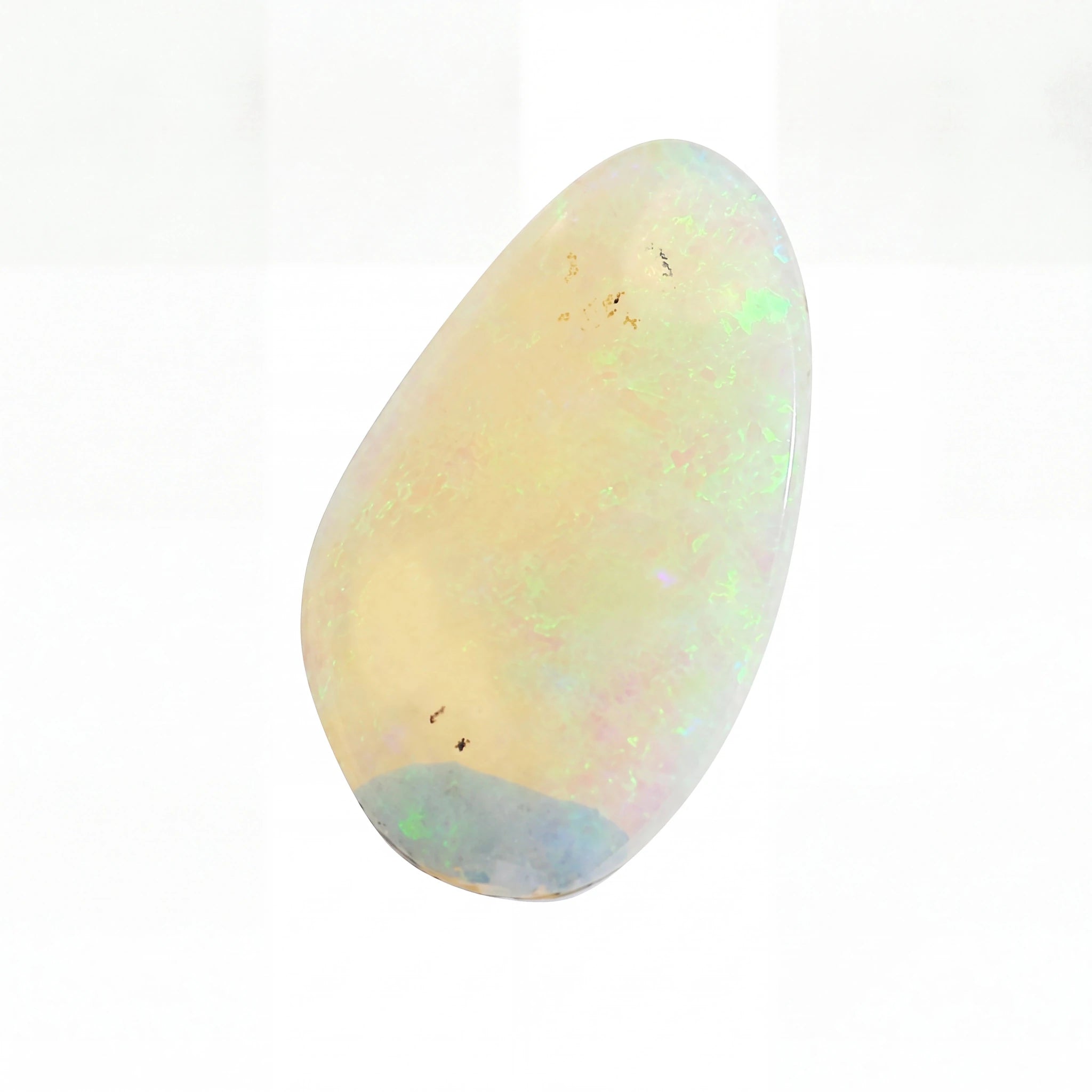 A polished teardrop-shaped cabochon opal gemstone with a creamy off-white base and vibrant iridescent flashes of green, blue, and pink, set against a plain white background.