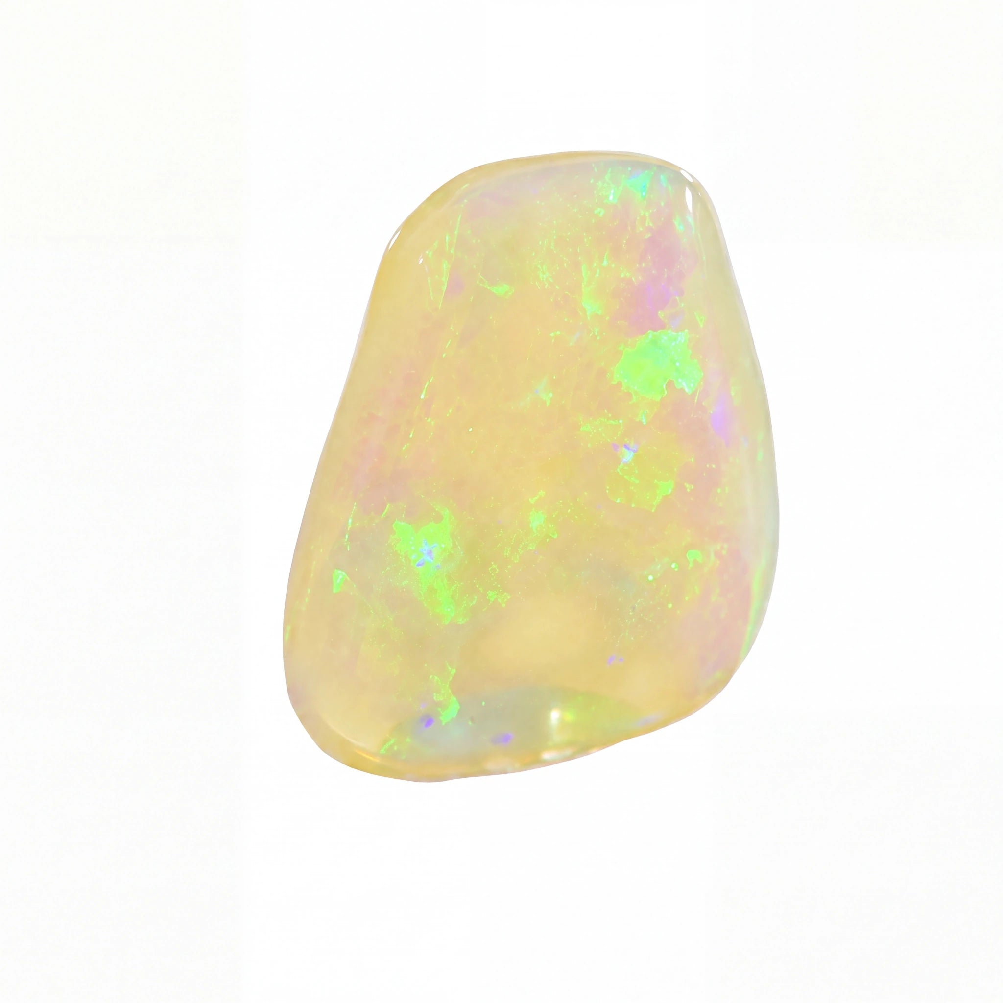 A polished, irregular-shaped opal gemstone displaying a creamy yellow base colour with vibrant, shifting flashes of green, purple, and blue, set against a plain white background.