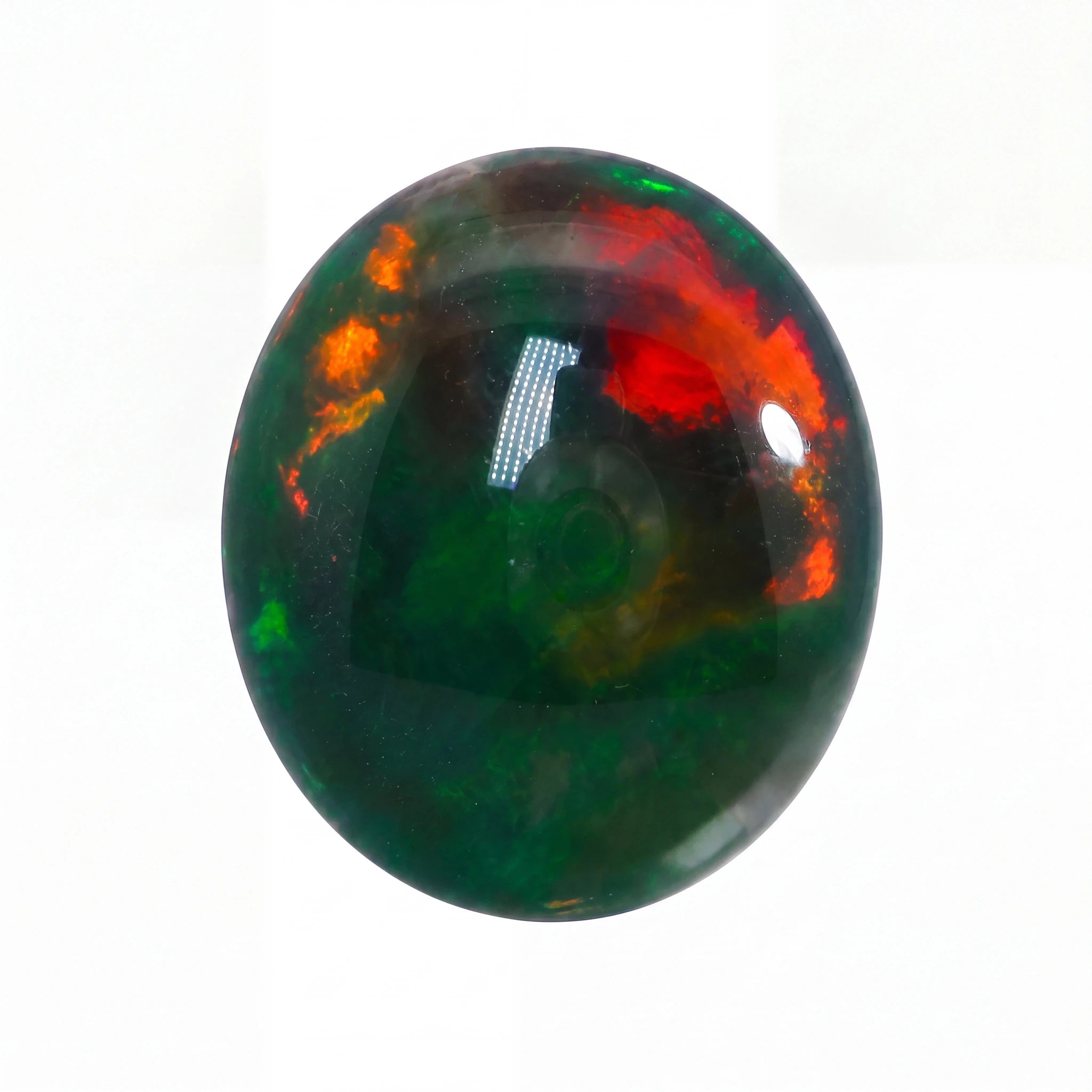Opal stone with green, red, and orange colours on a white background