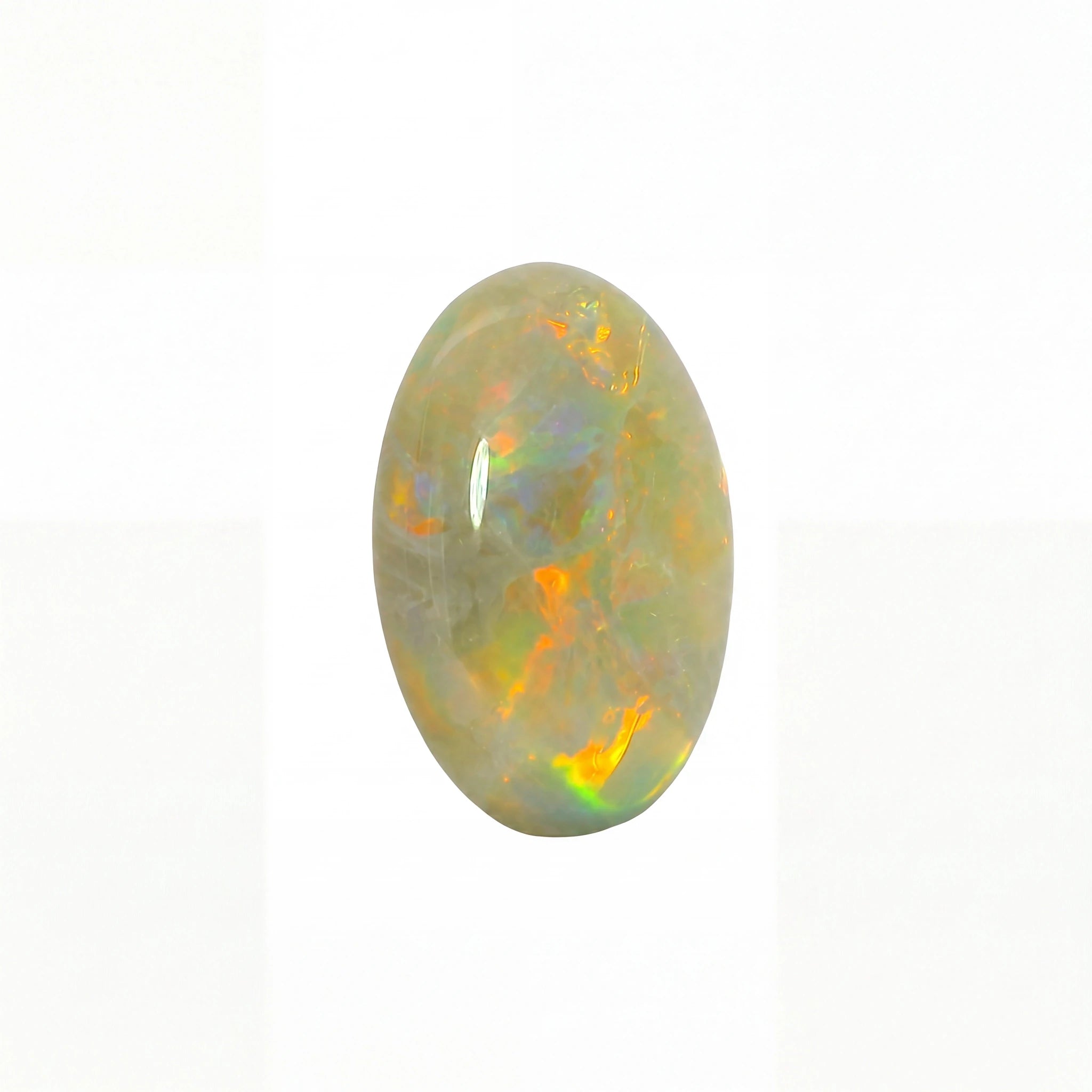 A polished oval cabochon opal gemstone displaying a play-of-colour with vibrant orange, yellow, and green flashes against a pale grey-white background.