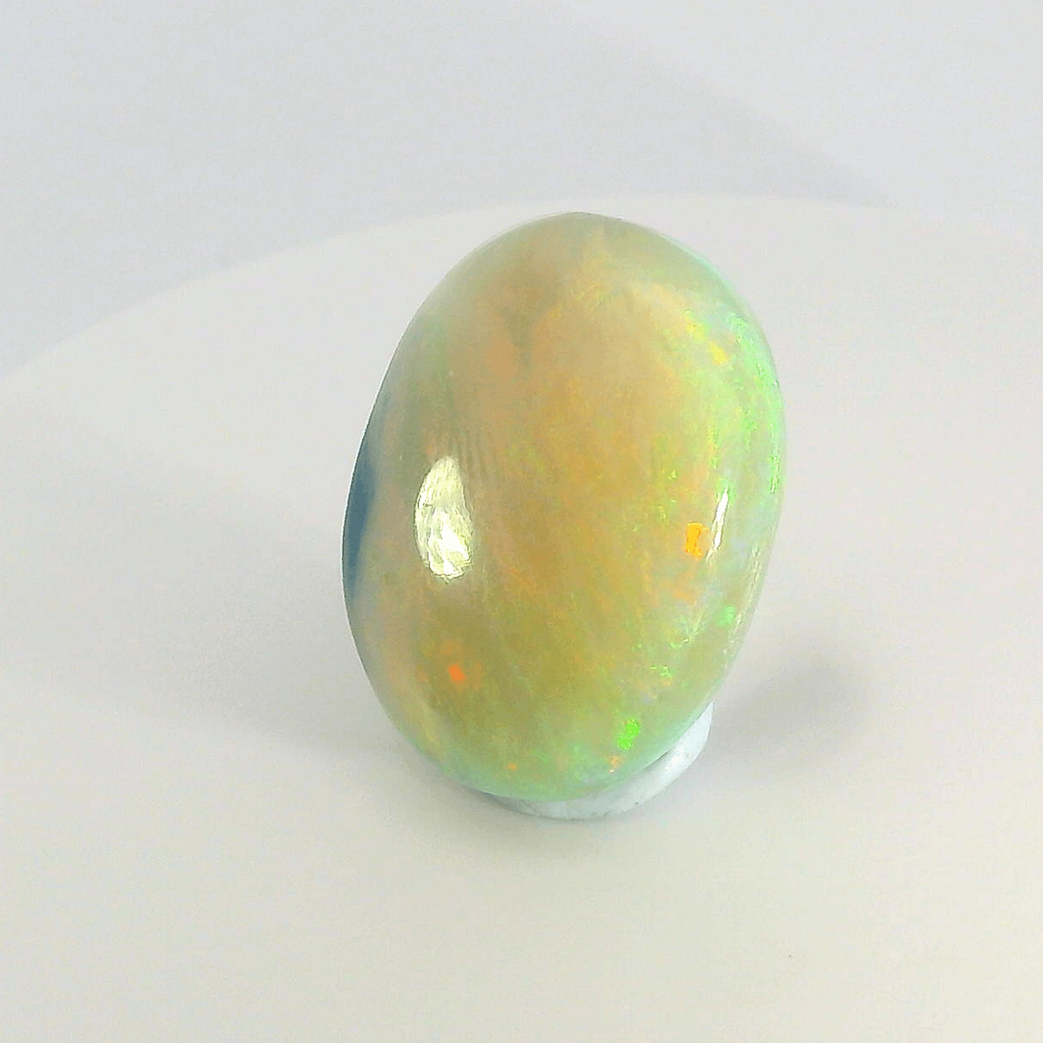 Vibrant Opal Gemstone in Hand - Australian Opal Cutters and Pearl Divers