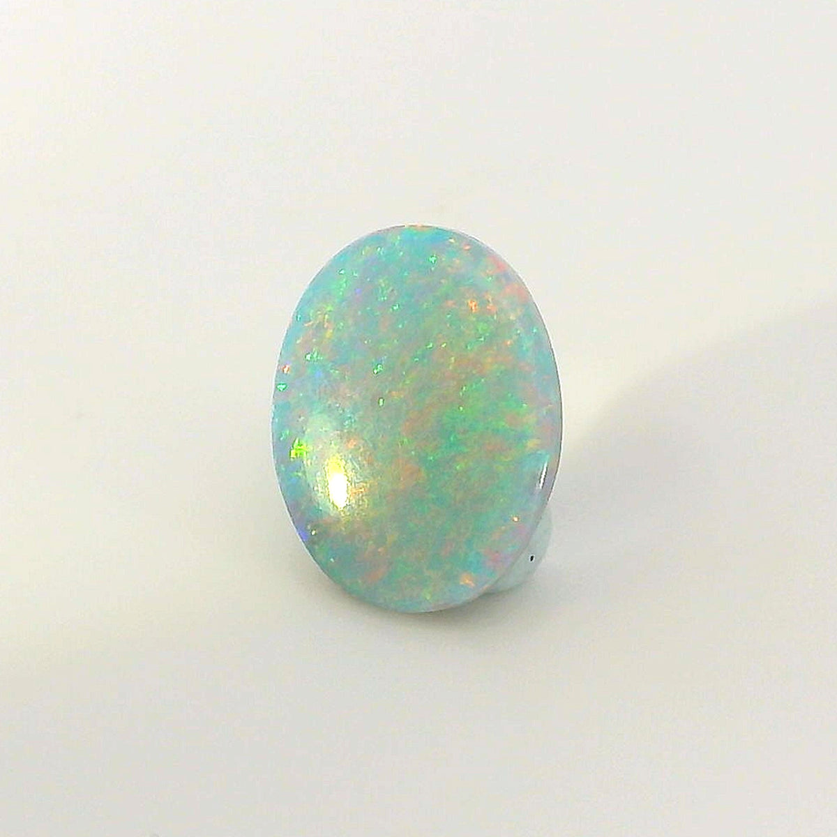 Vibrant Opal Gemstone in Hand