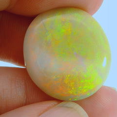 Vibrant Opal Gemstone in Hand
