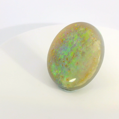 Vibrant Opal Gemstone in Hand
