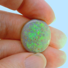 Vibrant Opal Gemstone in Hand