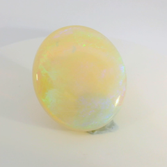 Vibrant Opal Gemstone in Hand