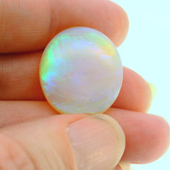 Vibrant Opal Gemstone in Hand