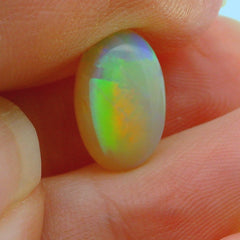Vibrant Opal Gemstone in Hand