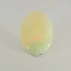 Glistening Opal Gemstone in Hand