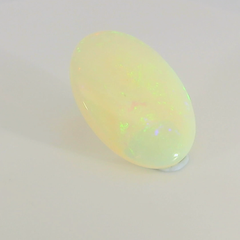 Glistening Opal Gemstone in Hand