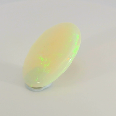 Glistening Opal Gemstone in Hand