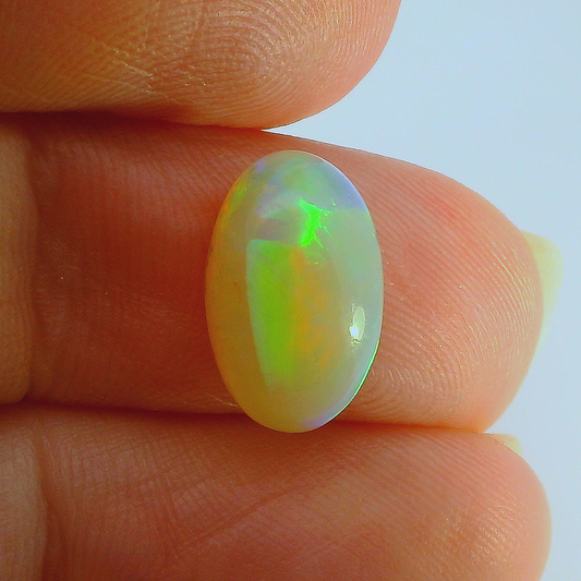 Vibrant Opal Gemstone in Hand