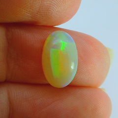 Vibrant Opal Gemstone in Hand