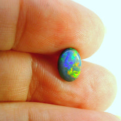 Vibrant Opal Gemstone in Hand