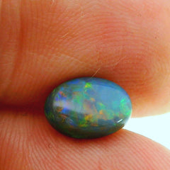 Vibrant Opal Gemstone in Hand