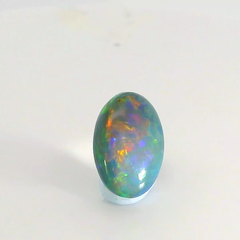 Vibrant Opal Gemstone in Hand
