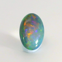 Vibrant Opal Gemstone in Hand