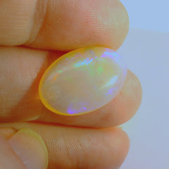Vibrant Opal Gemstone in Hand