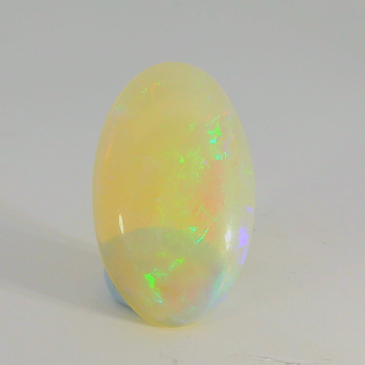 Vibrant Opal Gemstone in Hand