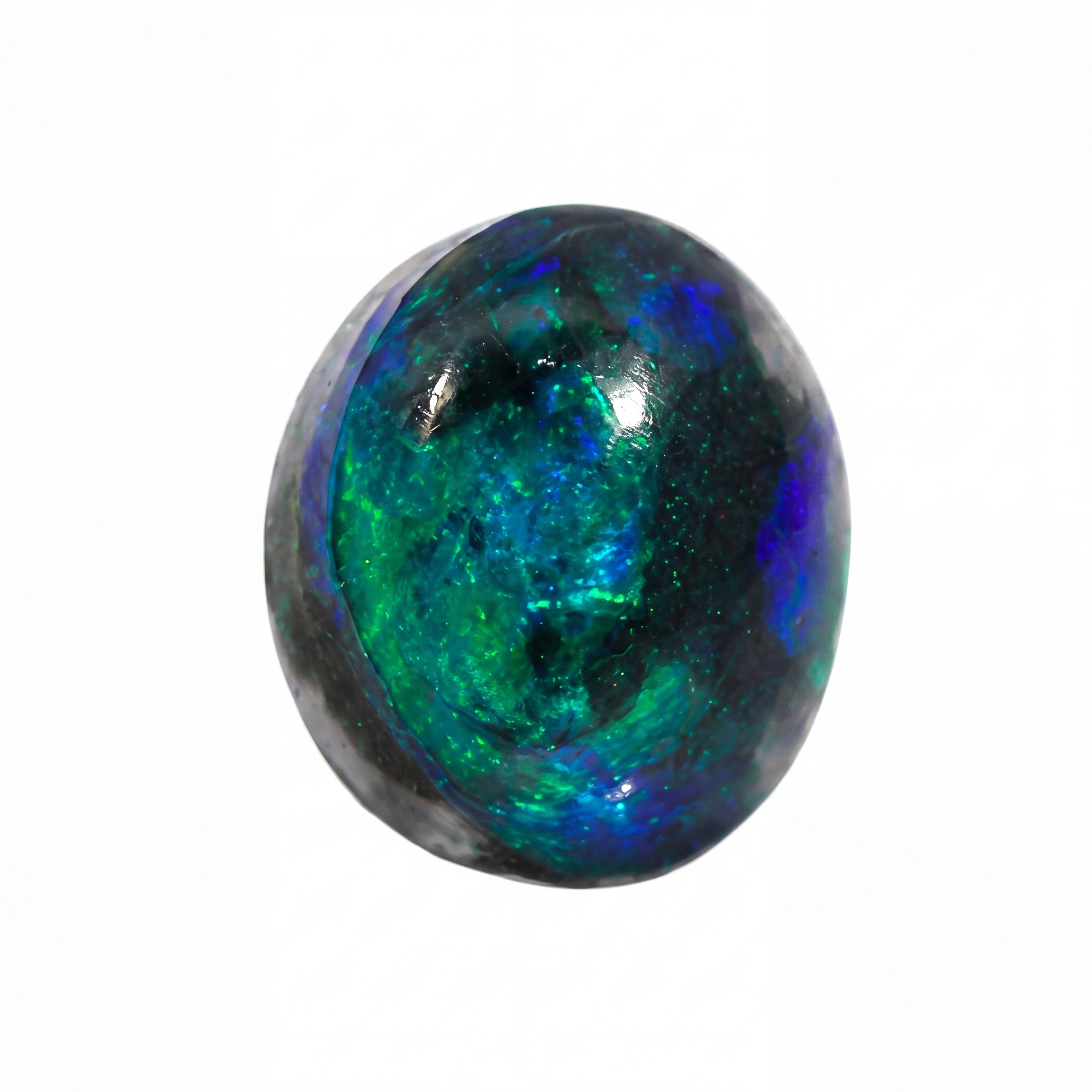 A polished oval cabochon gemstone featuring vibrant iridescent play-of-colour with green, blue, and purple hues over a dark base, set against a plain white background.