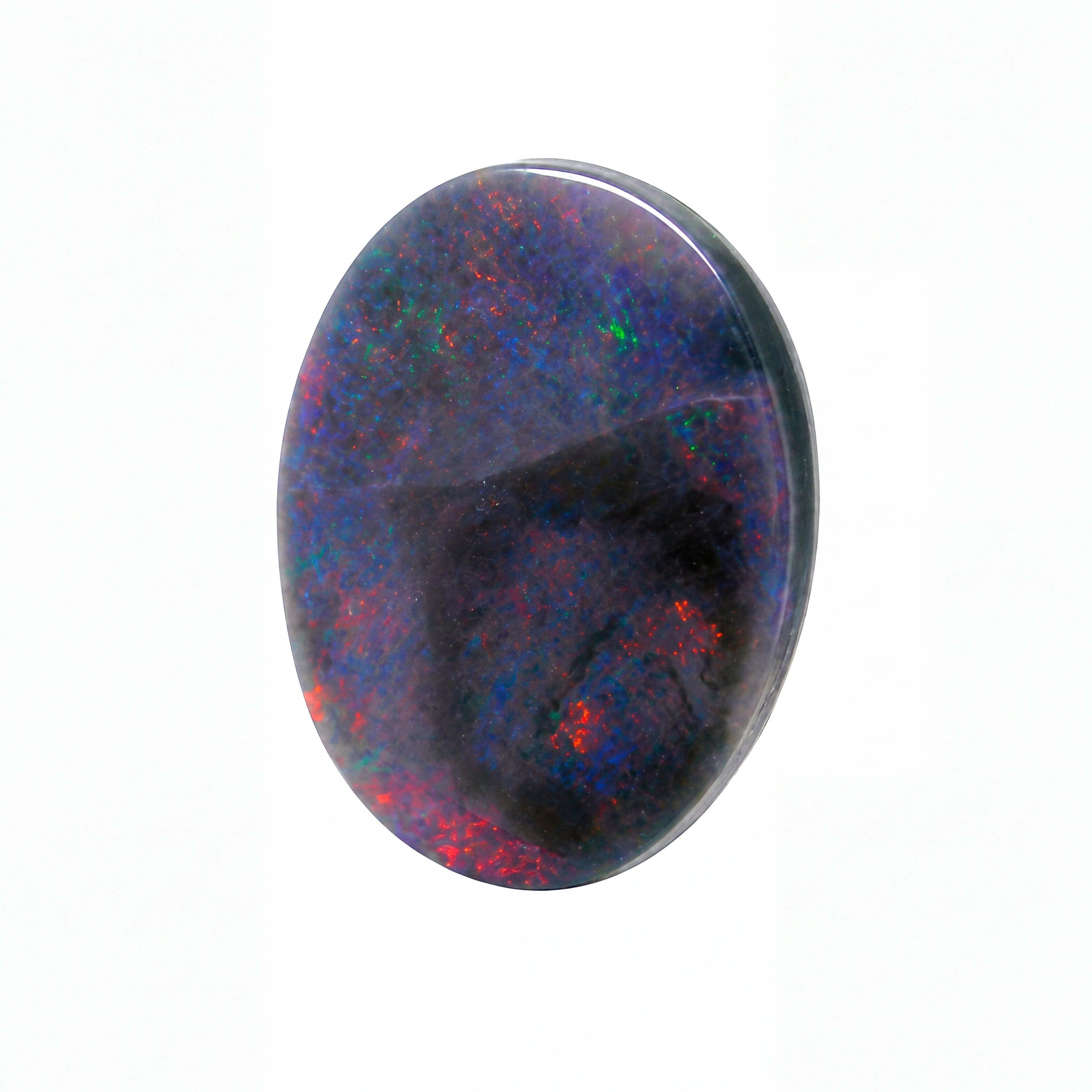 A polished oval cabochon gemstone featuring a black base with vibrant iridescent flashes of blue, green, and red, set against a plain white background.