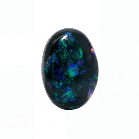 A polished oval cabochon gemstone featuring a dark base with vibrant flashes of blue, green, and purple iridescence, set against a plain white background.