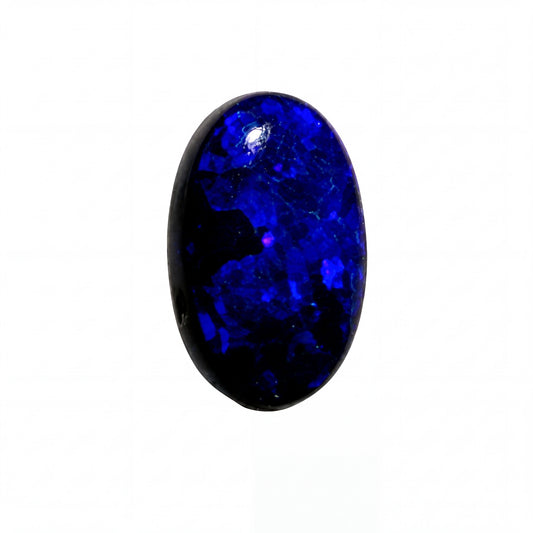 A polished oval cabochon gemstone with a deep blue to black color variation, showing natural crystalline texture and a bright reflective highlight, isolated on a solid white background.