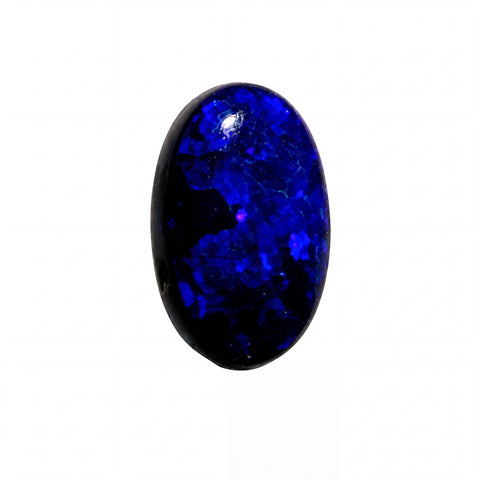 A polished oval cabochon gemstone with a deep blue to black color variation, showing natural crystalline texture and a bright reflective highlight, isolated on a solid white background.