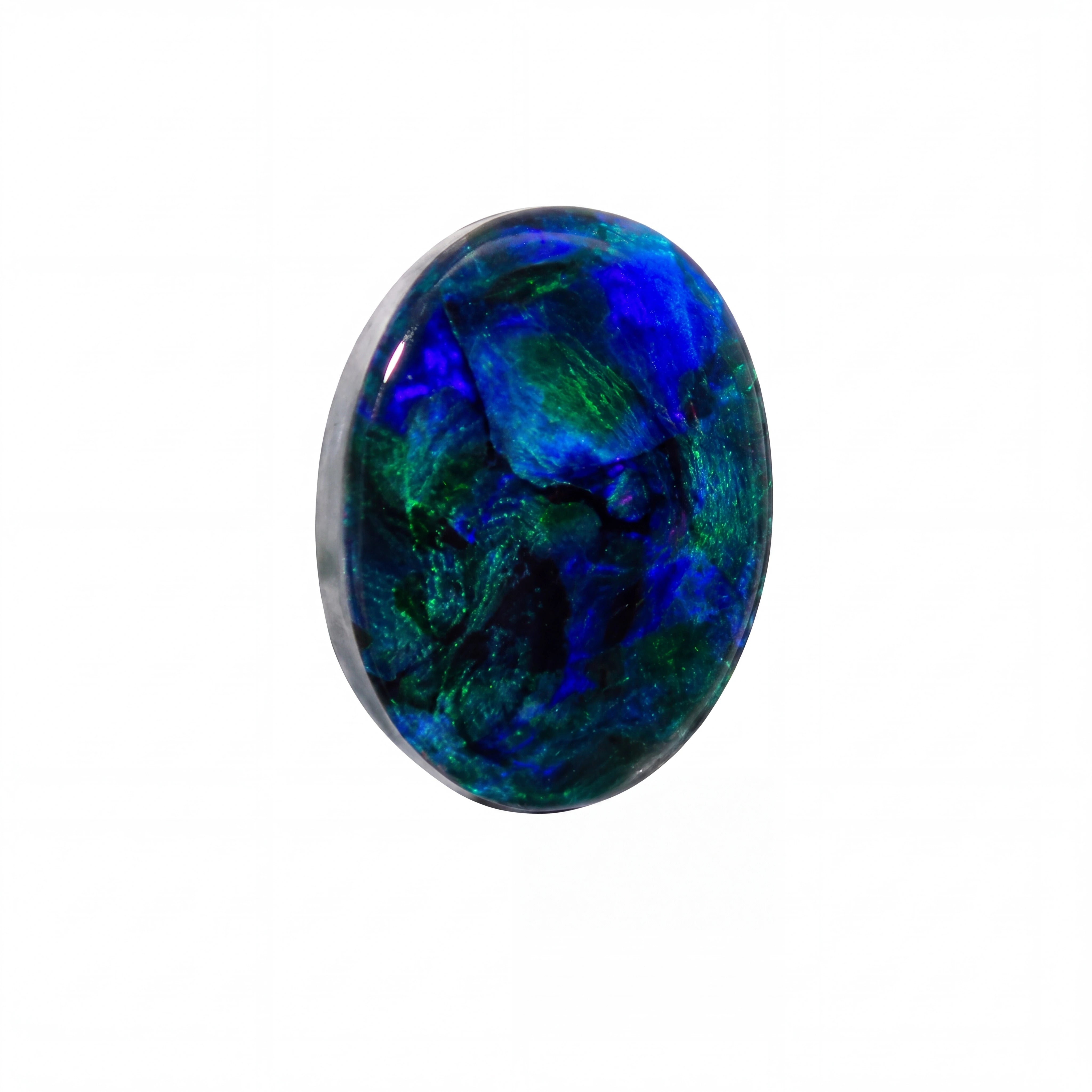 An oval cabochon gemstone featuring a vibrant play-of-colour with swirling patterns of deep blue, emerald green, and black, set in a polished silver bezel against a plain white background.