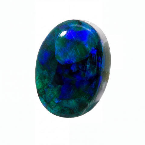 A polished oval cabochon gemstone featuring vibrant blue and green iridescent opal patterns, set against a solid white background.