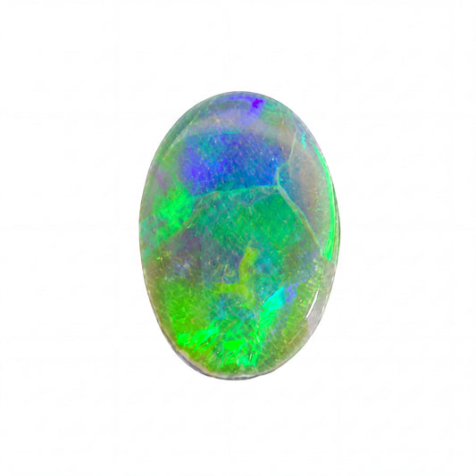 A polished oval cabochon opal gemstone displaying vibrant iridescent colours including green, blue, purple, and yellow on a solid white background.
