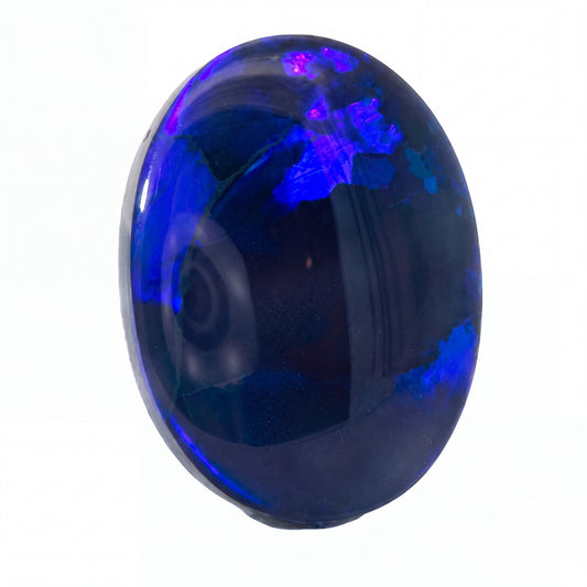 A polished oval cabochon gemstone with a deep blue body and vibrant purple-blue iridescent inclusions, shown on a plain white background.