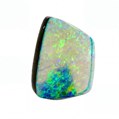 A polished irregular-shaped opal gemstone with a vibrant mottled pattern of blue, green, and yellow, centred on a plain white background.