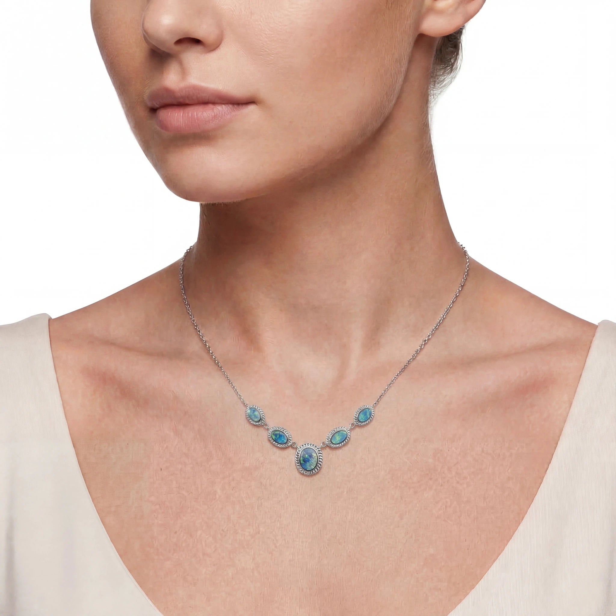 Necklace with blue opal stones worn by a model 