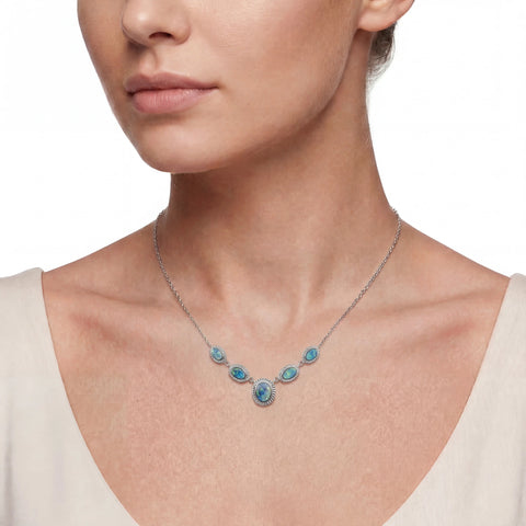 Necklace with blue opal stones worn by a model 
