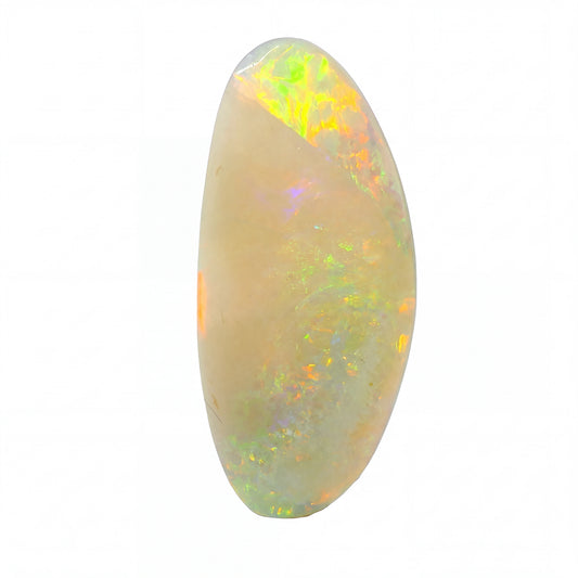 A polished oval cabochon opal gemstone displaying a creamy beige base with vibrant flashes of orange, yellow, green, and blue iridescence, set against a plain white background.