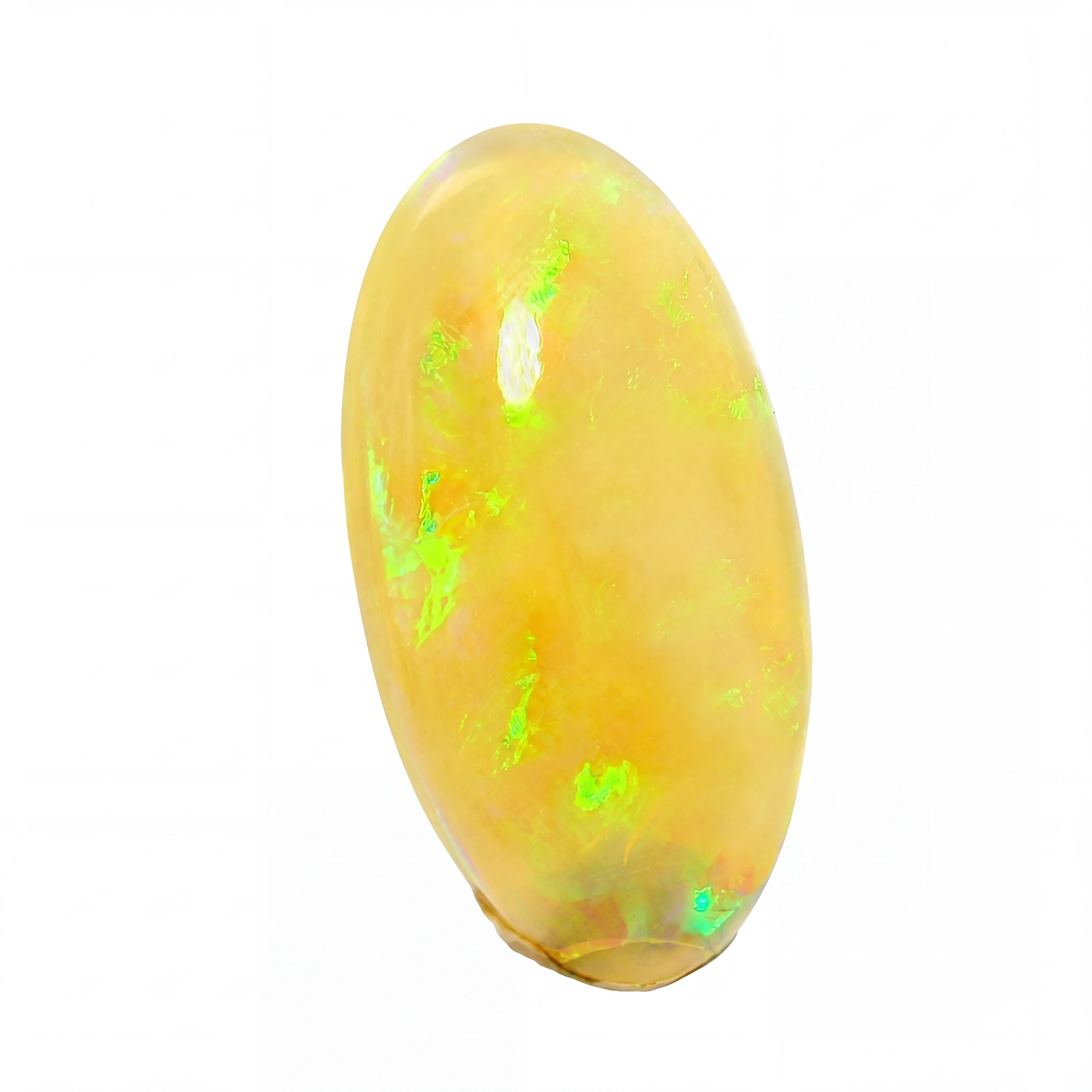 A polished oval cabochon gemstone with a warm golden-yellow body and vibrant green iridescent flashes, set against a plain white background.