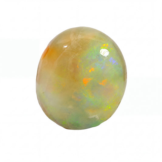 A polished cabochon opal gemstone with a rounded, oval shape, displaying a mix of creamy beige, soft green, and vibrant flashes of orange, blue, and yellow on a solid white background.