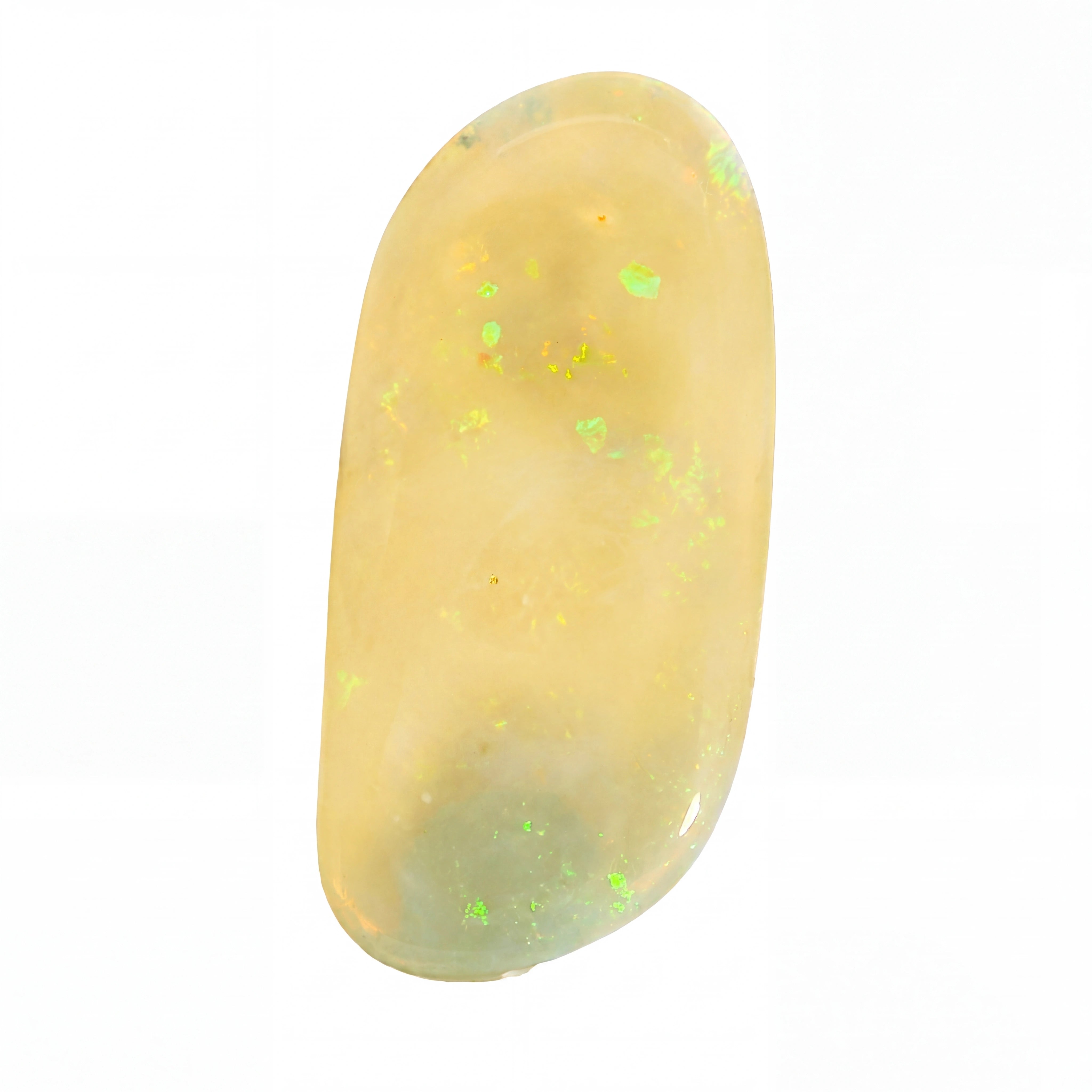 A polished oval cabochon gemstone with a creamy yellow body and scattered iridescent green flashes, shown on a plain white background.