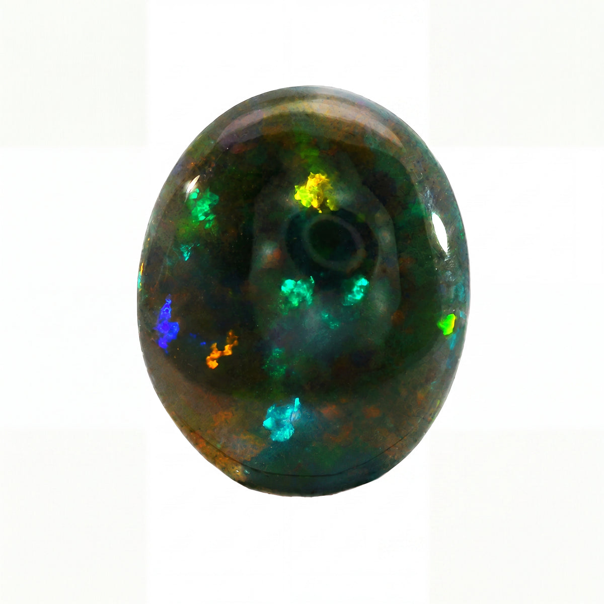 A polished oval cabochon gemstone featuring a dark base with vibrant, shifting flashes of green, blue, orange, and yellow, set against a plain white background.
