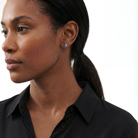 Woman wearing a black shirt with a neutral background