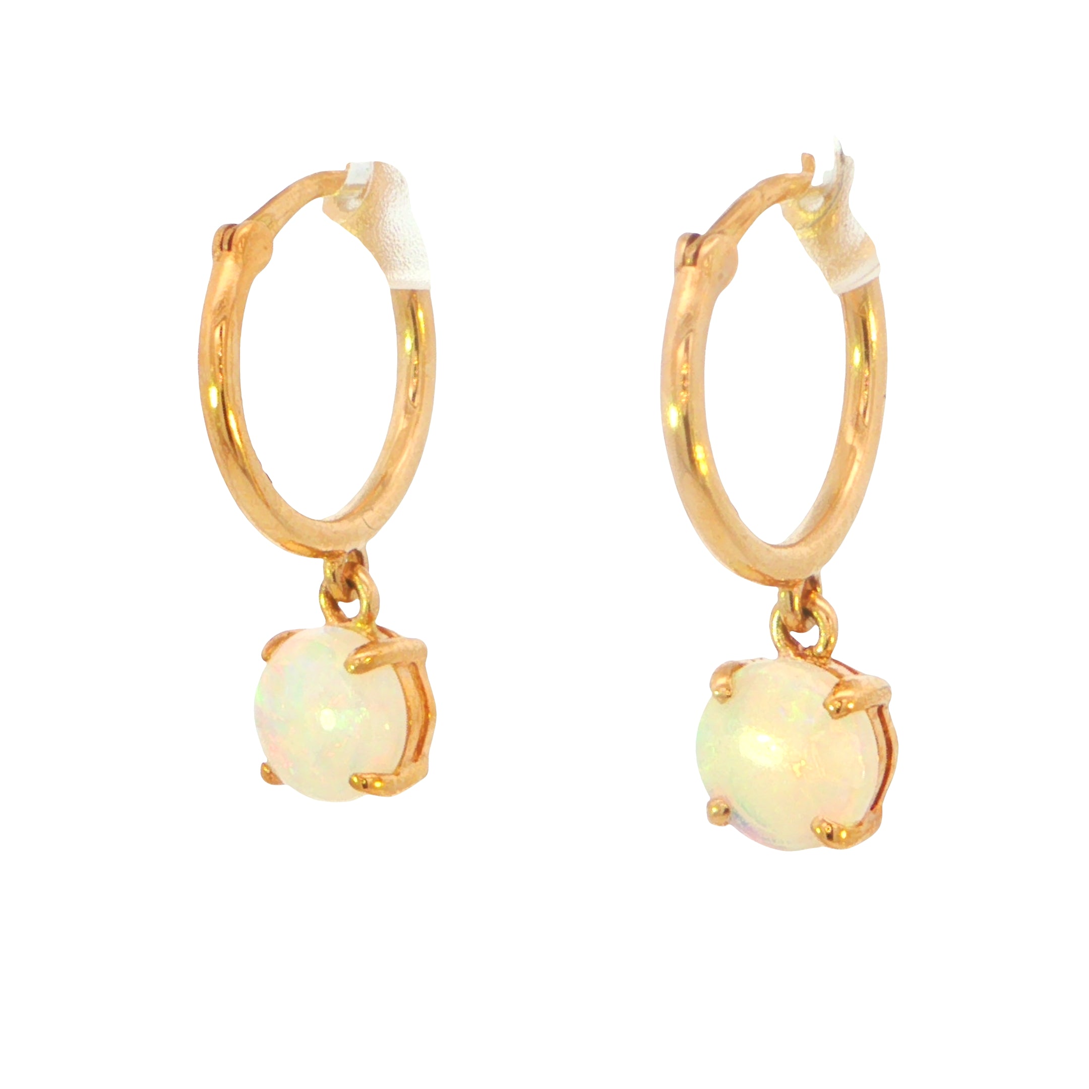 A pair of gold huggie hoop earrings with dangling round white opal gemstones in a four-prong setting, shown on a plain white background.