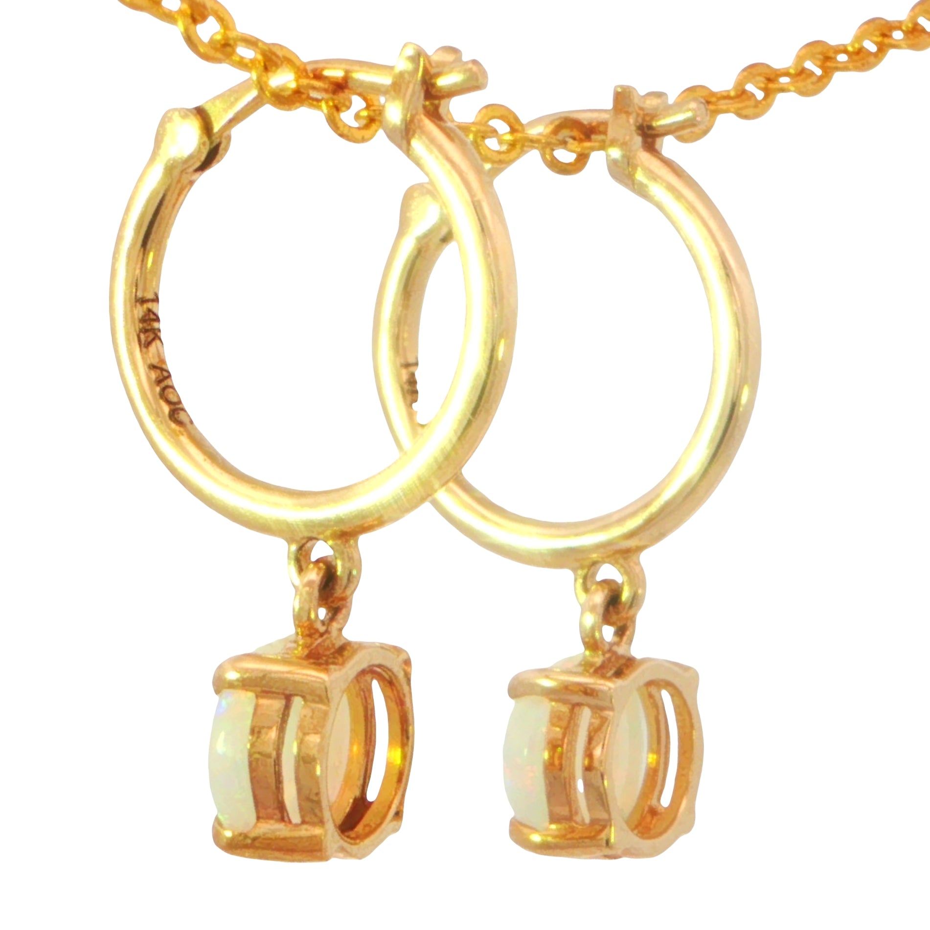 Gold hoop earrings with dangling cube-shaped settings holding milky white oval stones, shown on a white background with part of the gold chain visible.