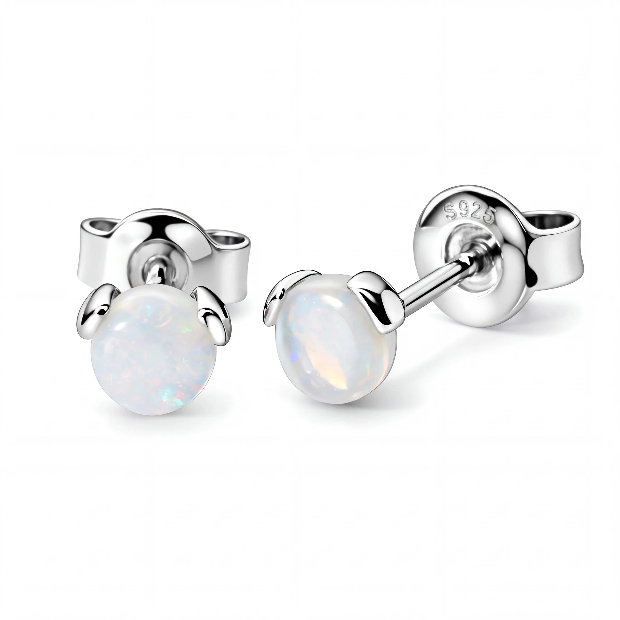 Silver earrings with round gemstones on a white background