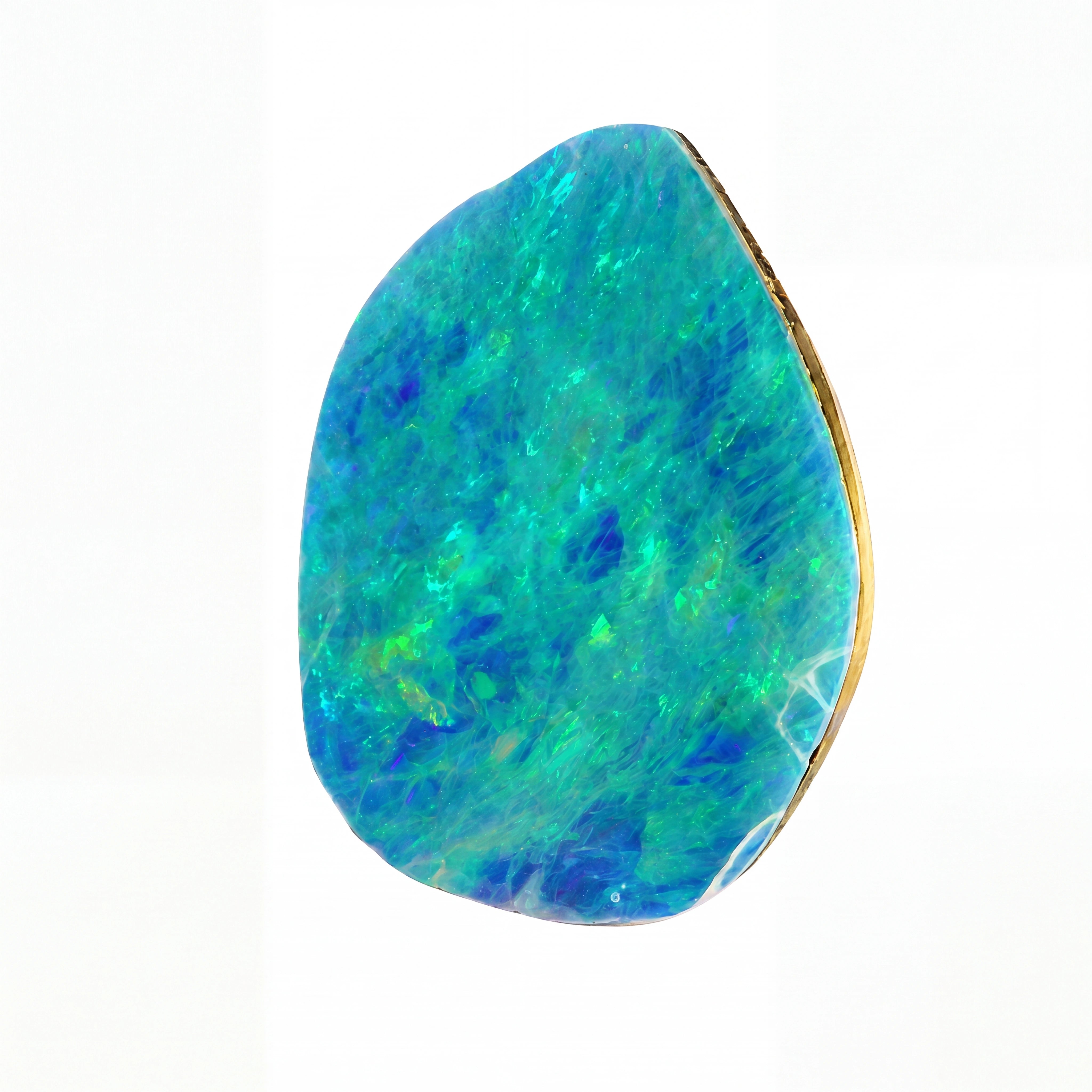 A teardrop-shaped loose opal gemstone with vibrant blue, green, and turquoise iridescent colours, set in a polished gold bezel, shown on a plain white background.