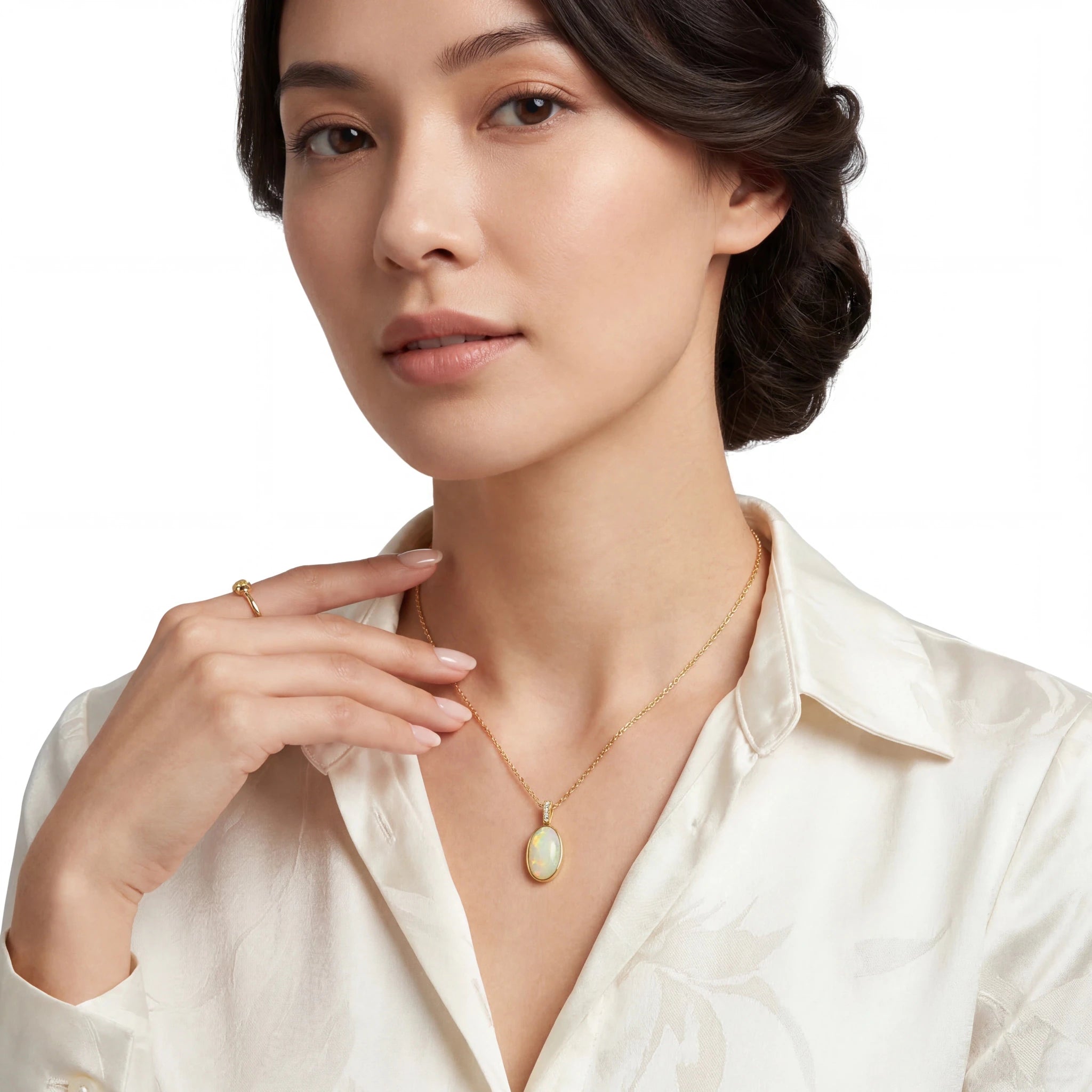 Woman wearing a gold necklace on a white background