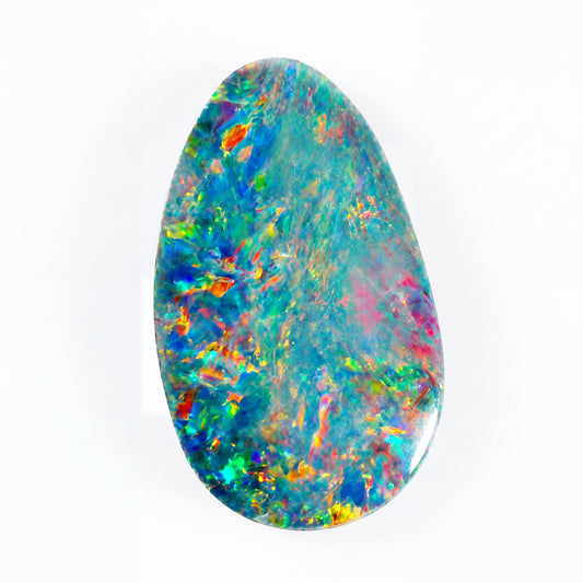 A polished teardrop-shaped opal gemstone displaying a vibrant mix of blue, green, orange, yellow, and pink iridescent colours on a solid white background.