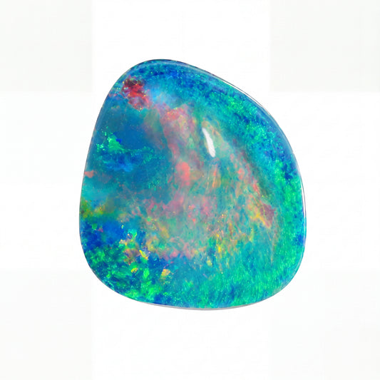 A polished natural opal gemstone with a fluid, organic shape, displaying a vibrant mix of blue, green, red, and yellow iridescent colours on a clean white background.