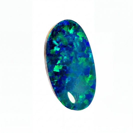 A single oval cabochon gemstone with a vibrant play-of-colour pattern of blue, green, and teal, set in a thin silver-toned metal bezel against a plain white background.