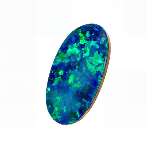 An oval-shaped natural opal gemstone with vibrant blue and green flashes, set in a polished gold bezel, shown on a plain white background.